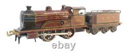 1915's Bing LMS Continental Clockwork 0-gauge Train Set with Continental Cars