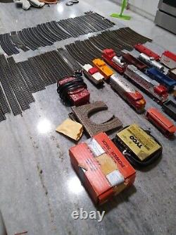 Huge Lot 72 pieces Tyco Lionel Trains Locomotive Track cars transformers & more